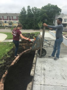 students planting garden