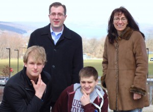 Nathaniel Schenheit, Gregory Kugler, and Bryan Anderson, Prof. Hofrenning at the National Conference for Undergraduate Research (NCUR – 2011) at Ithaca College, Ithaca, NY.