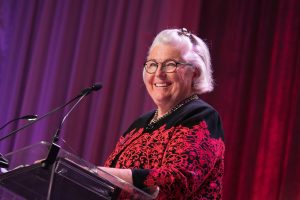 A smiling Cindy Piper at the podium at the 2016 StepUP Gala.