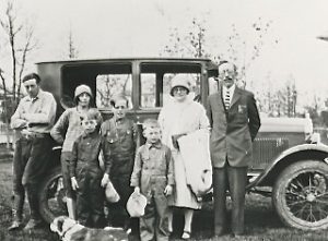 Hjelmeland family in the mid 1920s with Rev. John Hjelmeland pictured far right