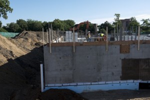 Crew members work atop basement walls - June 2016