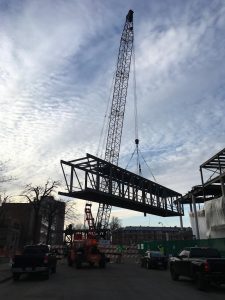 A section of the skyway is lifted by the tower crane