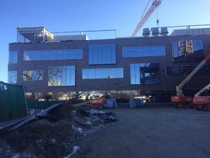 Glass installation is nearing completion on the west side of the north wing.