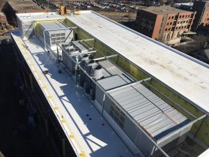 A view from the tower crane of the finished fourth-floor roof and adjacent mechanical area.