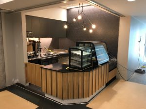 Corner coffee shop with counter and equipment