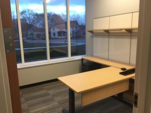 Office with desk and shelves