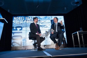 MPR's Tom Weber, left, talks with Daniel Wordsworth of the American Refugee Committee.