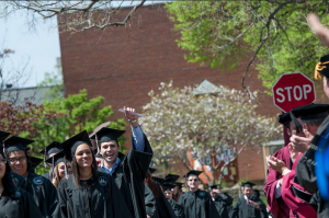 Students in Spring 2015 process down Seven and a Half Street to Si Melby Hall for Commencement Ceremonies.