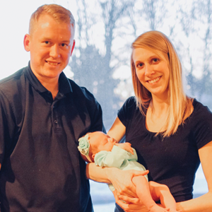 Rick, Ashley, and baby Wolke photographed together