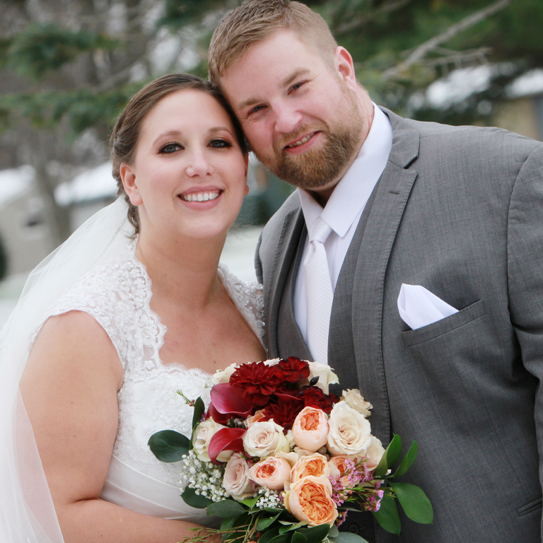 Leah and her husband posed on their wedding day