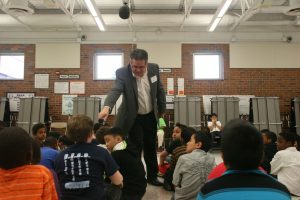 Dennis Donovan working with school children