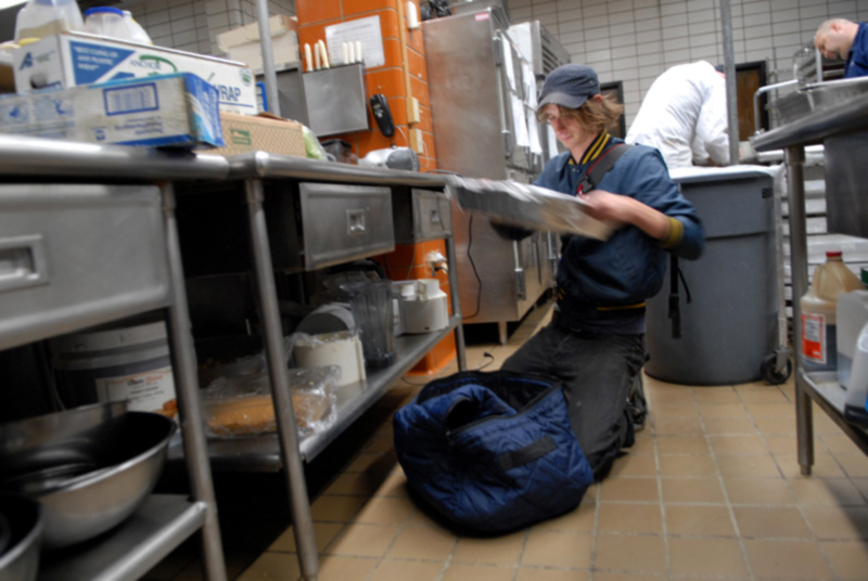 Student prepares food in the Commons kitchen