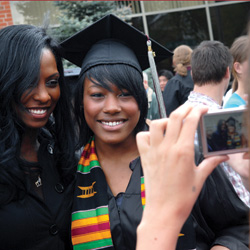 Women pose for a graduation photo