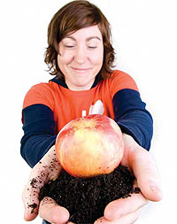 Student holds an apple