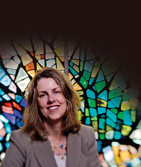 Lori Brandt Hale in front of stained glass window