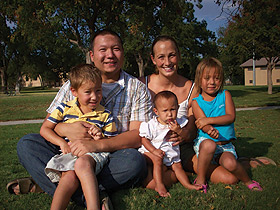 Lewis Nelson poses with his wife and three children